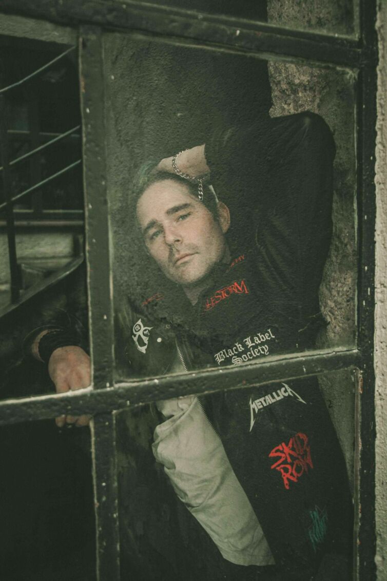 A portrait photograph with a dark, artistic retouch, featuring a metal enthusiast leaning in from the other side of a window, willingly participating in the metal community, symbolizing the dedication and unity of metal enthusiasts.